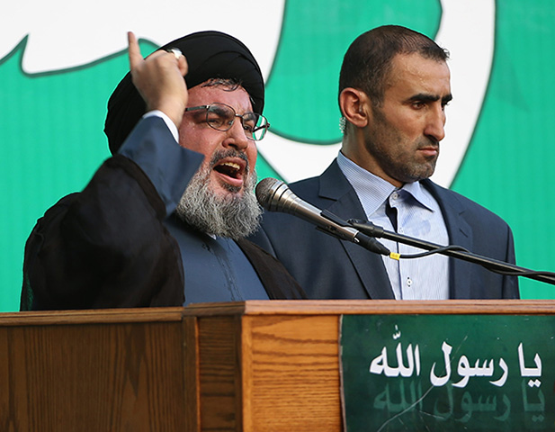 Vodca libanonského šiitského hnutia Hizballáh šejk Hasan Nasralláh (vľavo)